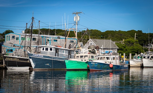 Chilmark, United States – May 06, 2020: A view of many fishing boats in a harbor in Chilmark, United States
