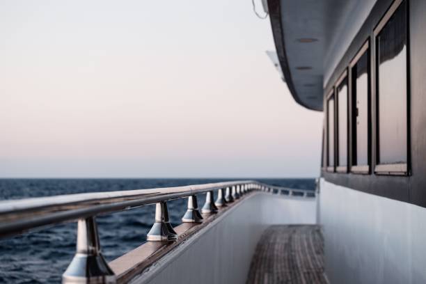 istock View along a yacht balcony with deck toward the stern against a cloudless sky 1441834155