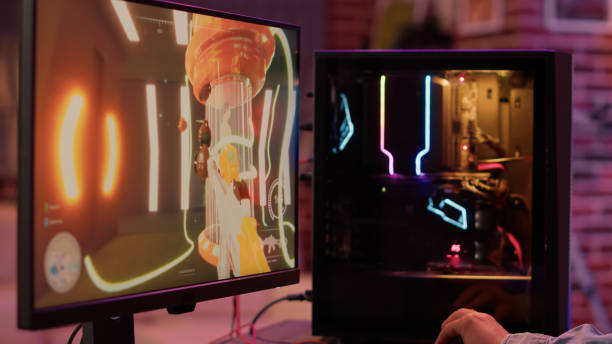 istock Static tripod shot of professional gaming pc setup screen streaming first person shooter online 1441835326