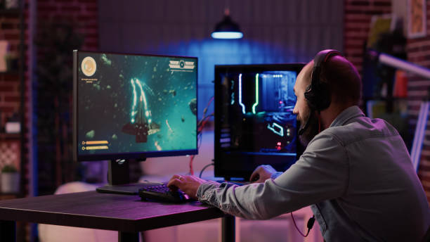 istock Gamer streaming competiton in online space shooter feeling disappointed after losing on gaming pc 1441836077