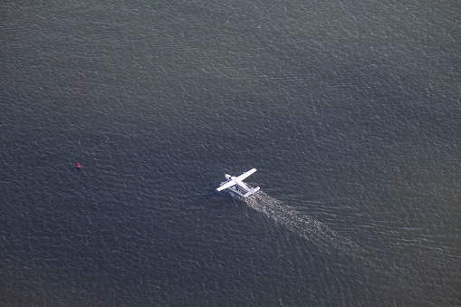 A beautiful view of a seaplane taxiing on Boston harbor