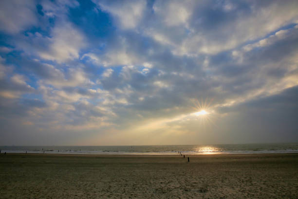 istock Beautiful tranquil scenery of a sandy beach under a cloudy sky at sunrise 1441837291
