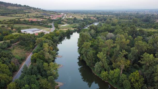 istock Aerial view of a deep river surrounded by dense forests 1441837443