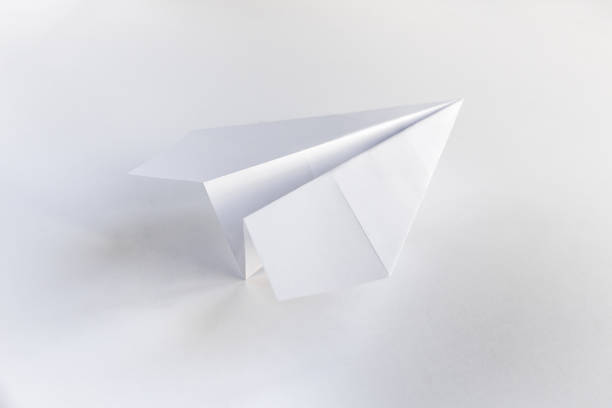 istock Paper plane origami isolated on a white background 1441837535