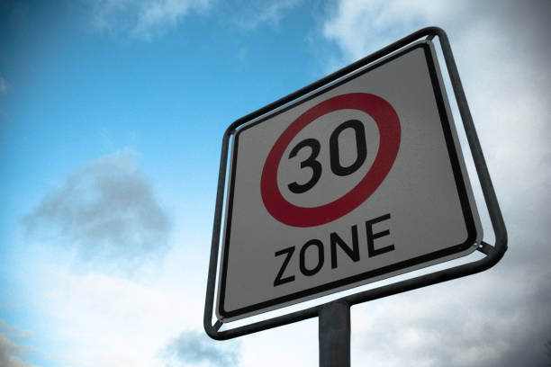 istock Low angle shot of a 30 speed limit sign 1441838370