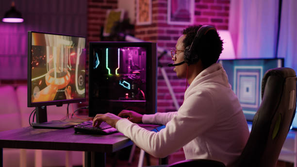 istock African american gamer relaxing playing online action game using pc gaming setup and talking to team 1441838420