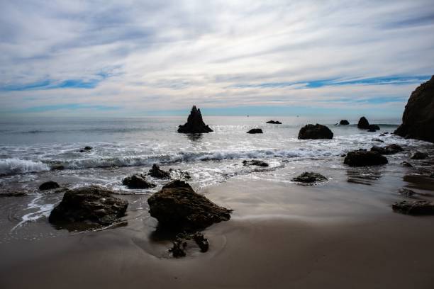istock Rocky ocean coast at sunset 1441838878