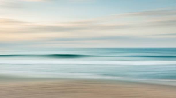 istock Long exposure of sandy beach at scenic sunset 1441838943