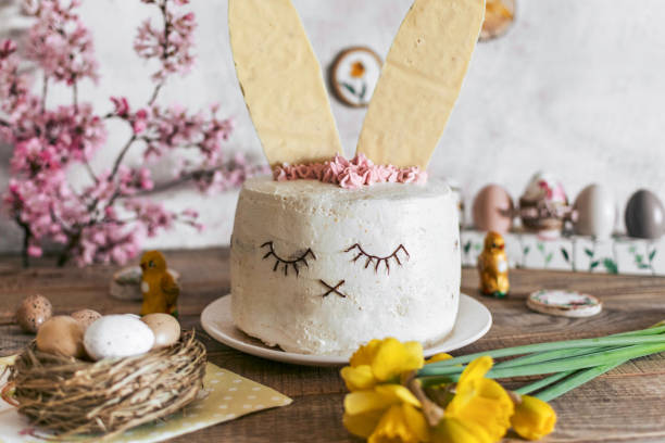 istock Easter cake decorated as a bunny. Holiday, food, desert, spring, easter eggs, flowers. 1441839007