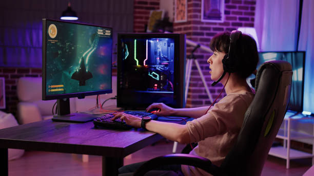 istock Woman relaxing and streaming on internet fast paced space shooter simulation gameplay 1441839710