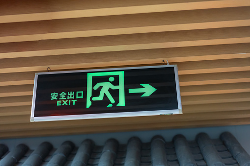 Safety exit sign on the ceiling