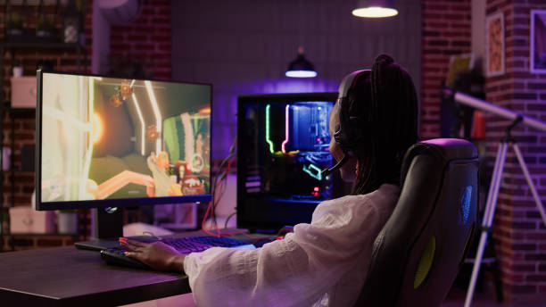 istock African american gamer girl using pc gaming setup aving a good time playing multiplayer online action game 1441840857