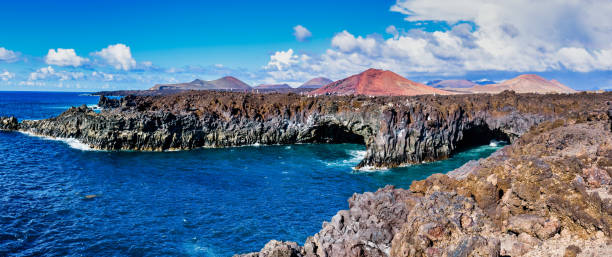 istock Panoramic shot of Los Hervideros under a blue cloudy sky in Spain 1441841149