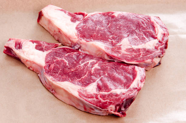 istock raw ribeye steaks, ethically raised and organic 1441841480