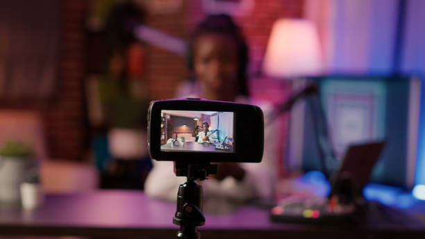 istock Selective focus on digital video camera screen recording african american woman streaming live internet show 1441841532