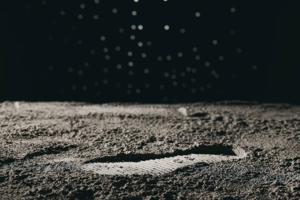 istock Footprint on the moon against a bokeh background 1441841685