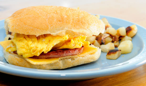 istock hearty egg with sausage and cheese on a bun with hashbrowns 1441841705