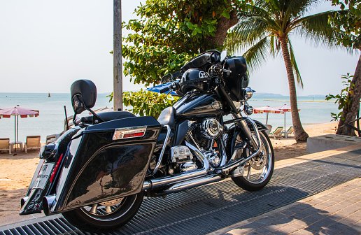 Pattaya, Thailand – February 19, 2021: Today we discovered this beautiful Harley on the beach of Jomtien.\nJomtien is the southern part of Pattaya District Chonburi.