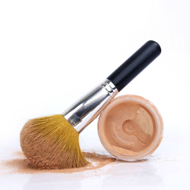istock Powder and make-up brush on white background 1441842673