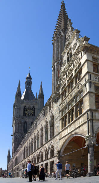 Ypres, Belgium – May 06, 2018: Three-quarters-on view of Cloth Hall in Ypres, Belgium. This building houses In Flanders Fields Museum about battles in Flanders in First World War.