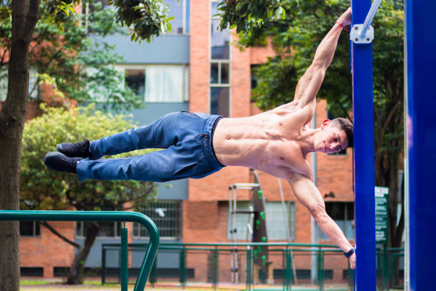 istock Hot young muscular man working out on horizontal bars 1441843533