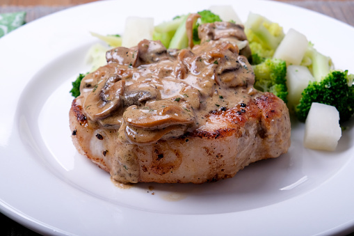 seared pork chop, mushroom gravy with kohlrabi, a ketogenic diet meal