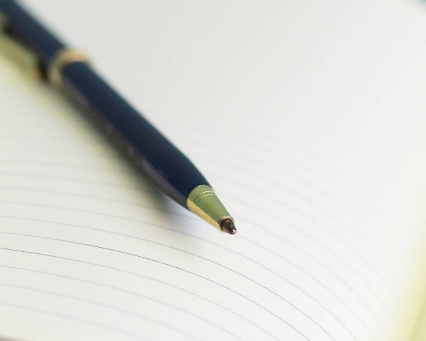 istock Selective focus shot of the blank notepad with a pen 1441844106