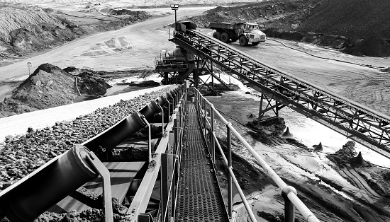 Witbank, South Africa – February 20, 2021: Witbank, South Africa - July 25 2011: Coal Ore on a conveyor belt for processing
