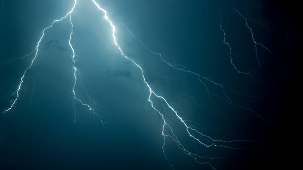istock Low angle shot of the scary lightning in the night sky 1441844344