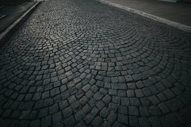 istock Closeup of the old cobblestone pavement 1441844835