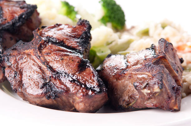 istock lamb chops grilled to perfection with vegetable risotto 1441844842