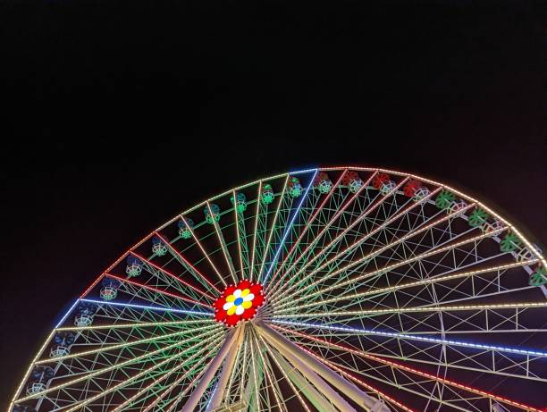 istock Low angle shot of a colorful Ferris wheel 1441846609