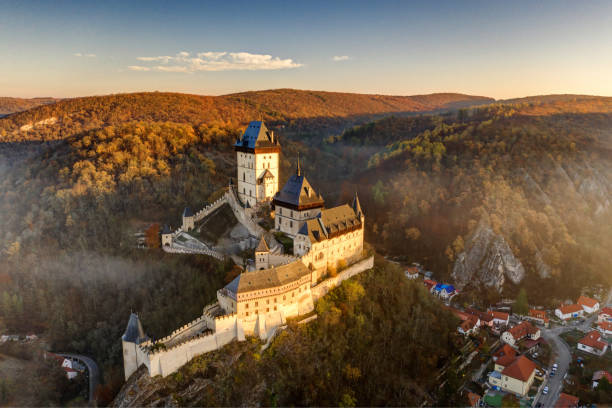Karlstejn, Beroun, Czech Republic – November 10, 2019: Stunning aerial shot of Karlstein Castle - the most famous medieval landmark in the Czech Republic from 14th Century built by Charles IV.
