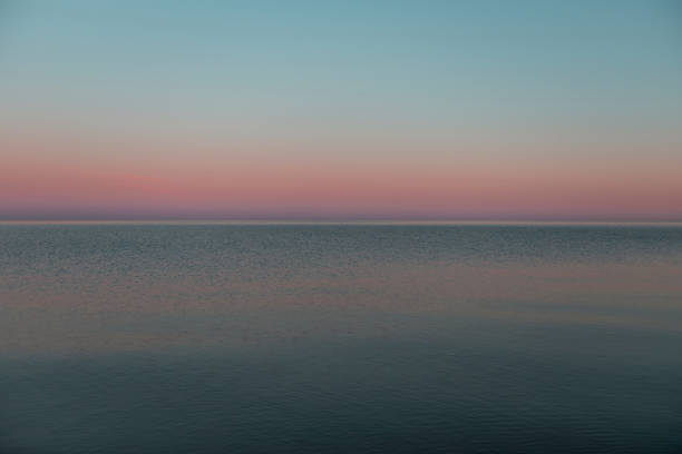 istock Beautiful sunset over a tranquil lake 1441847170