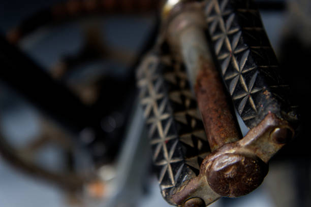 A closeup shot of an old and rusty bicycle pedal on a blurred background