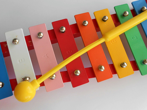 A closeup shot of a colorful xylophone with bat children musical toy