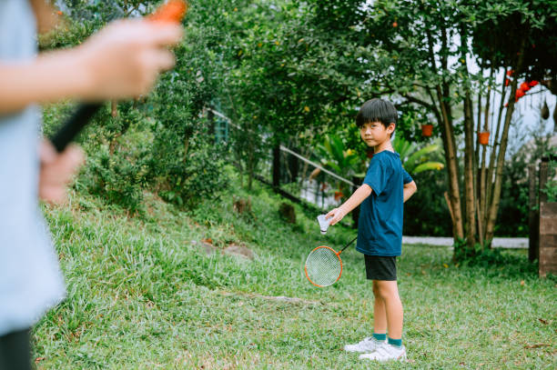 istock Asian Chinese boy learning badminton from grandfather. 1441848367