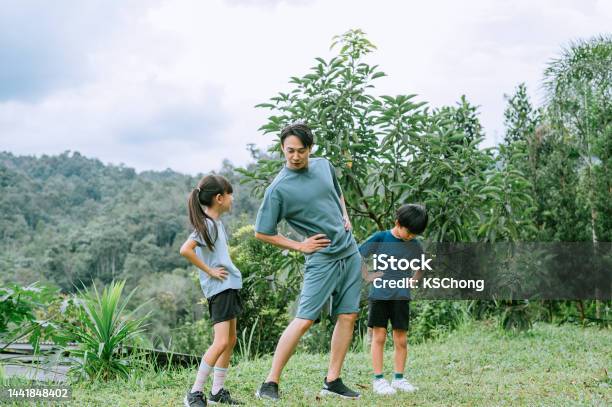 Come Lets Do Warming Up Exercise Stock Photo - Download Image Now - 30-34 Years, 8-9 Years, Active Lifestyle