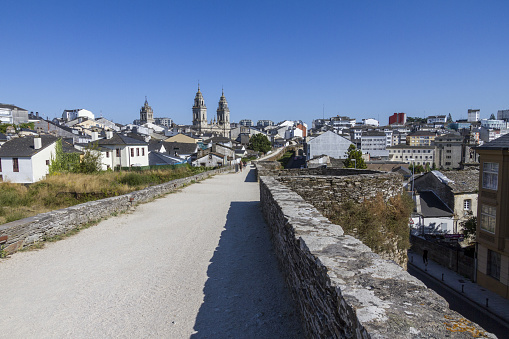 A shot of a road in a residential area with different buildings in Lugo, Spain