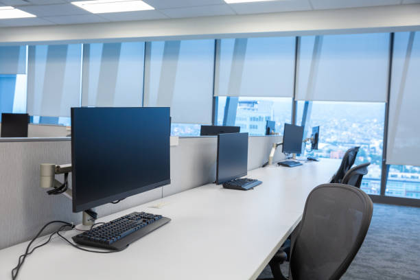 istock Interior of an empty modern office with computers on desks during Covid-19 quarantine 1441849895