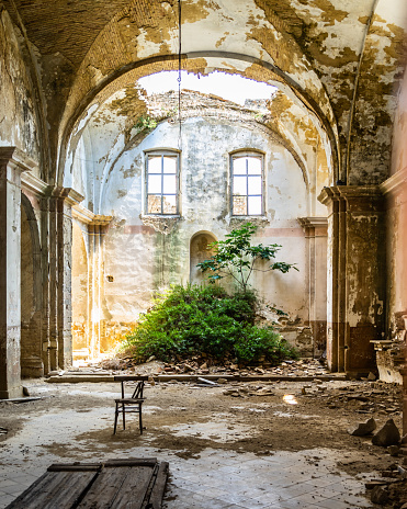 An abandoned church in Craco, a ghost town in Basilicata region abandoned due to a landslide, Italy