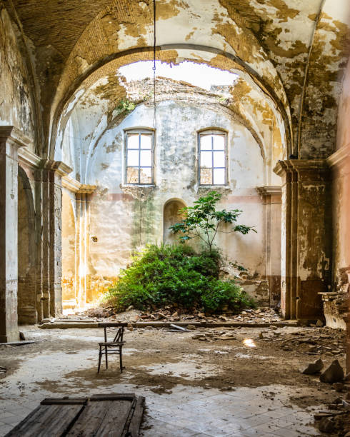 interior of an abandoned church in craco, a ghost town in basilicata region, italy - matera imagens e fotografias de stock