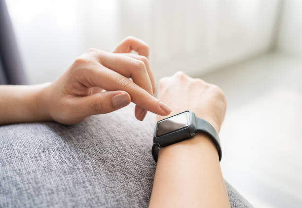 istock Young woman using smartwatch on her wrist 1441852224