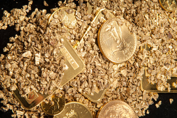 istock gold in coins, nuggets and ingots 1441853120