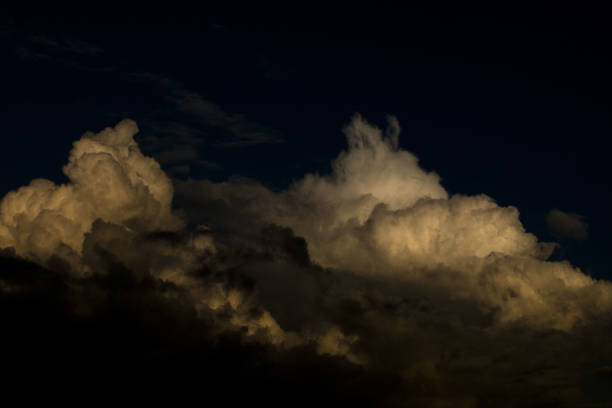 istock Scenic view of partly dark clouds in the sky with copy space 1441853253
