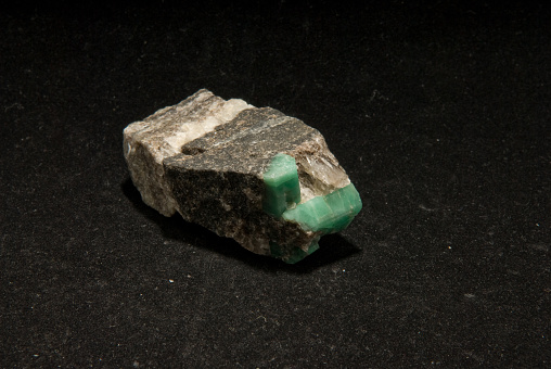 A closeup shot of Emerald mineral isolated on a black background