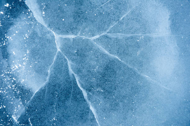 istock Top view of a cracked ice layer under the lights - perfect forwallpapers 1441853825
