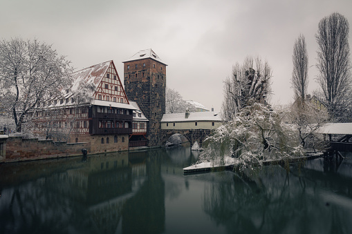 Henkersteg in the historic oldtown of Nuremberg during winter with snow and ice.