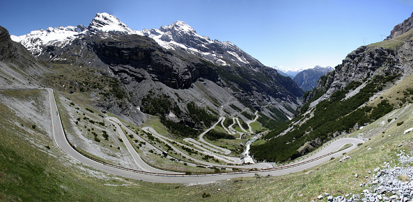 Stilfser Joch (stevio pass) extremely winding road panorama scene, longest road pass in Europe, remains of snow in spring