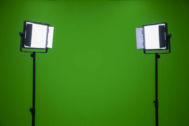 istock Green screen television studio with two fill lights. Lights are on in chroma studio 1441854293
